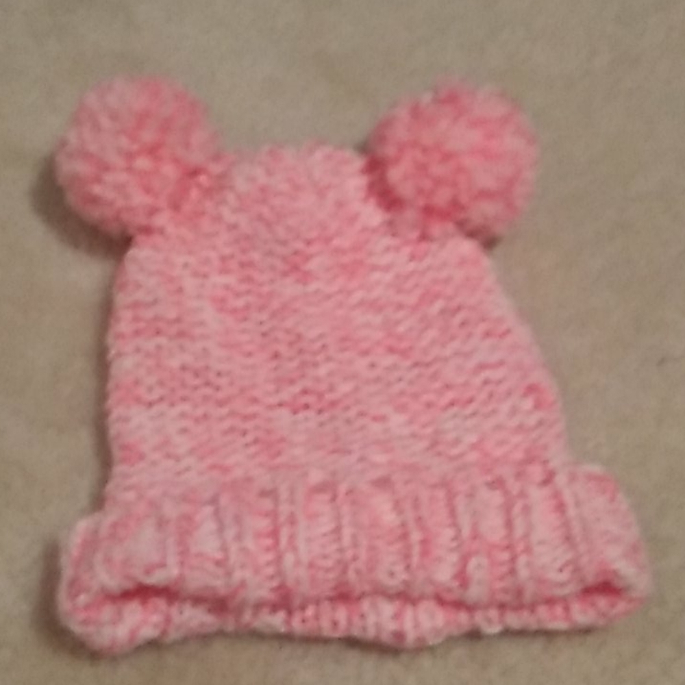 Pink and white toddler girls hat.